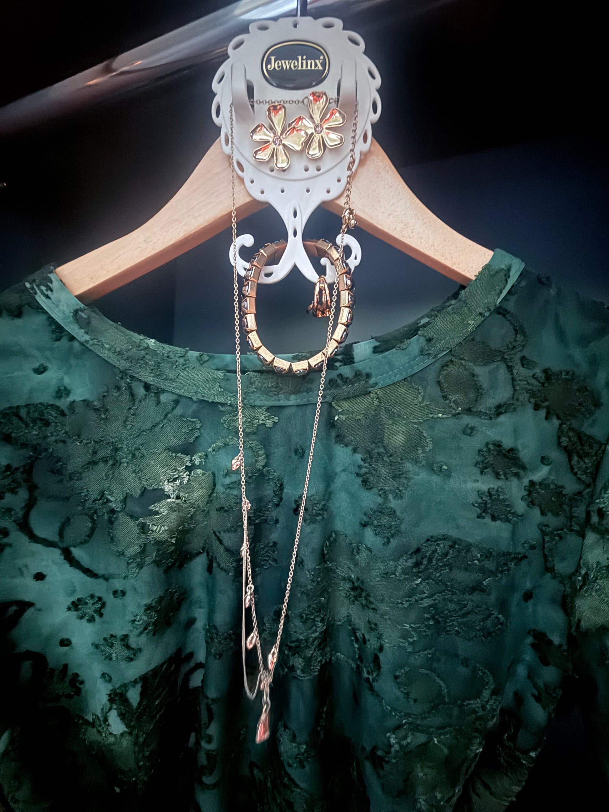 Evening jewelry paired to an outfit on a Jewelinx hanging organizer before a night out